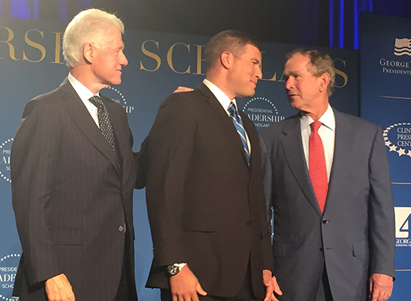Russell Kavalhuna (center) with former Presidents Bill Clinton (left) and George W. Bush (right).