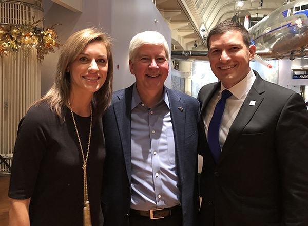 Russell Kavalhuna (right) with Courtney Kavalhuna and former Michigan Governor Rick Snyder.