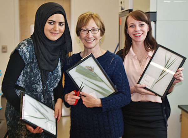 Two female Honors graduates pictured with HFC instructor, Linda Brandt.