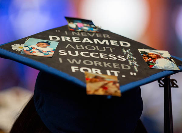 Closeup of a graduate's decorated cap.