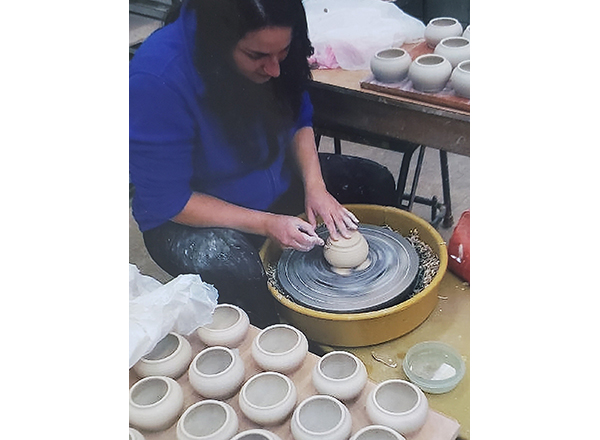 Hard at work on the pottery wheel, Erin Hoekzema creates her next masterpiece. 