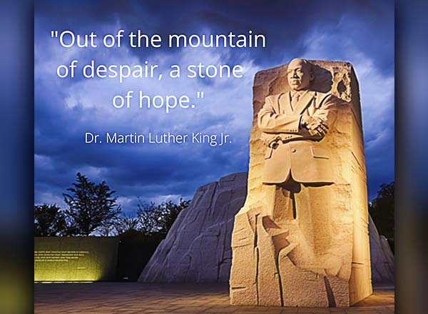 An image of Martin Luther King, Jr. carved stone and a quote from him that reads "Out of the mountain of despair, a stone of hope."
