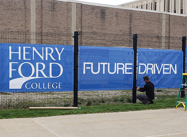 New fence and light pole/building banners installed on campus. See other banner photos below.