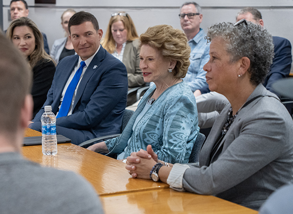 Trustee Irene Watts, President Kavalhuna, Senator Stabenow, and Stabenow senior aide Terry Campbell discuss the IEMP and its impacts on the future of energy and careers.