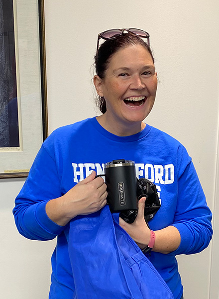 Bridget Smith-Botos proudly shows off her new YETI mug. 
