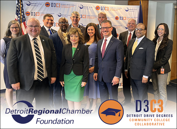 A photo of a group of people standing in front of a backdrop with Detroit Chamber and D3C3 logos at the foot of the image.