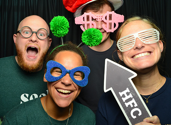 Students wearing silly props for the photo booth station at the HFC Welcome Back Days event.