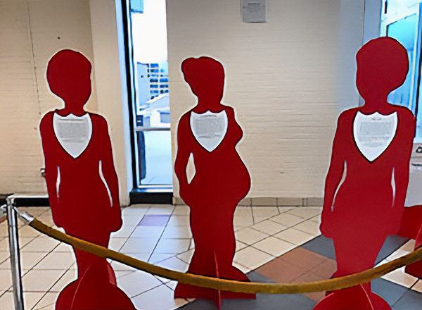 Red silhouettes of domestic violence victims