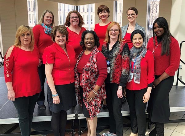 HFC employees wearing red.