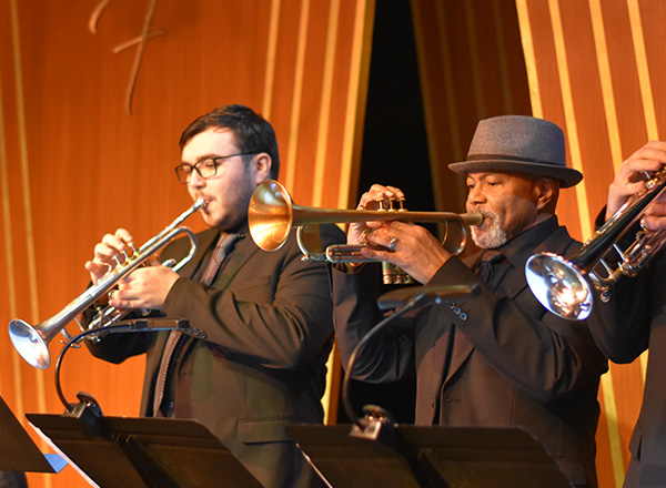 Trumpeters performing at a concert.