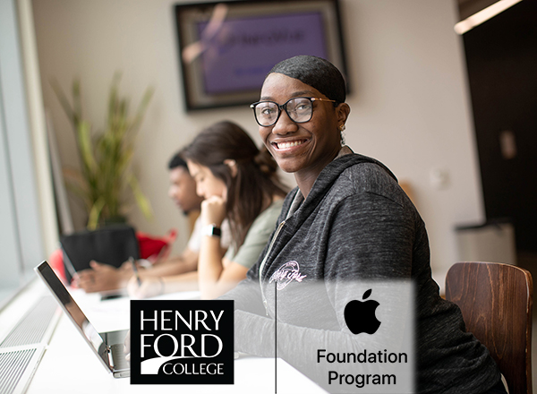 HFC students using computers, HFC and Apple approved logos visible