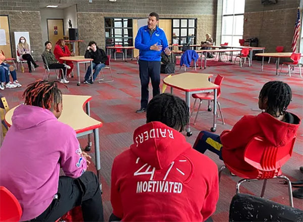 President Kavalhuna presents information to students from Ecorse High School