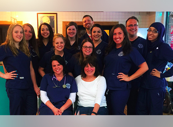 HFC nursing faculty member Cathy Gangarossa (seated, right) and a group of HFC nursing students and alumni who went on a volunteer medical trip to Belize last year. This year, Gangarossa is planning a volunteer medical trip to Central America at the end of December. 