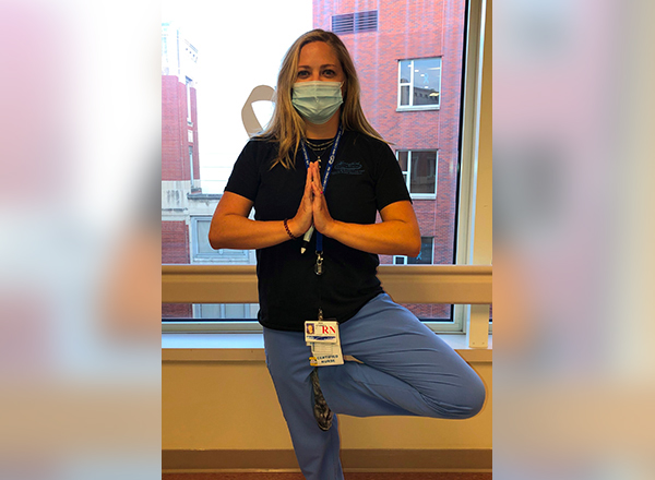 HFC alumna Andrea Corrie is a registered nurse at Henry Ford Health System. She recently earned her certification to teach yoga, which has helped her cope as she works the front lines during the coronavirus pandemic.