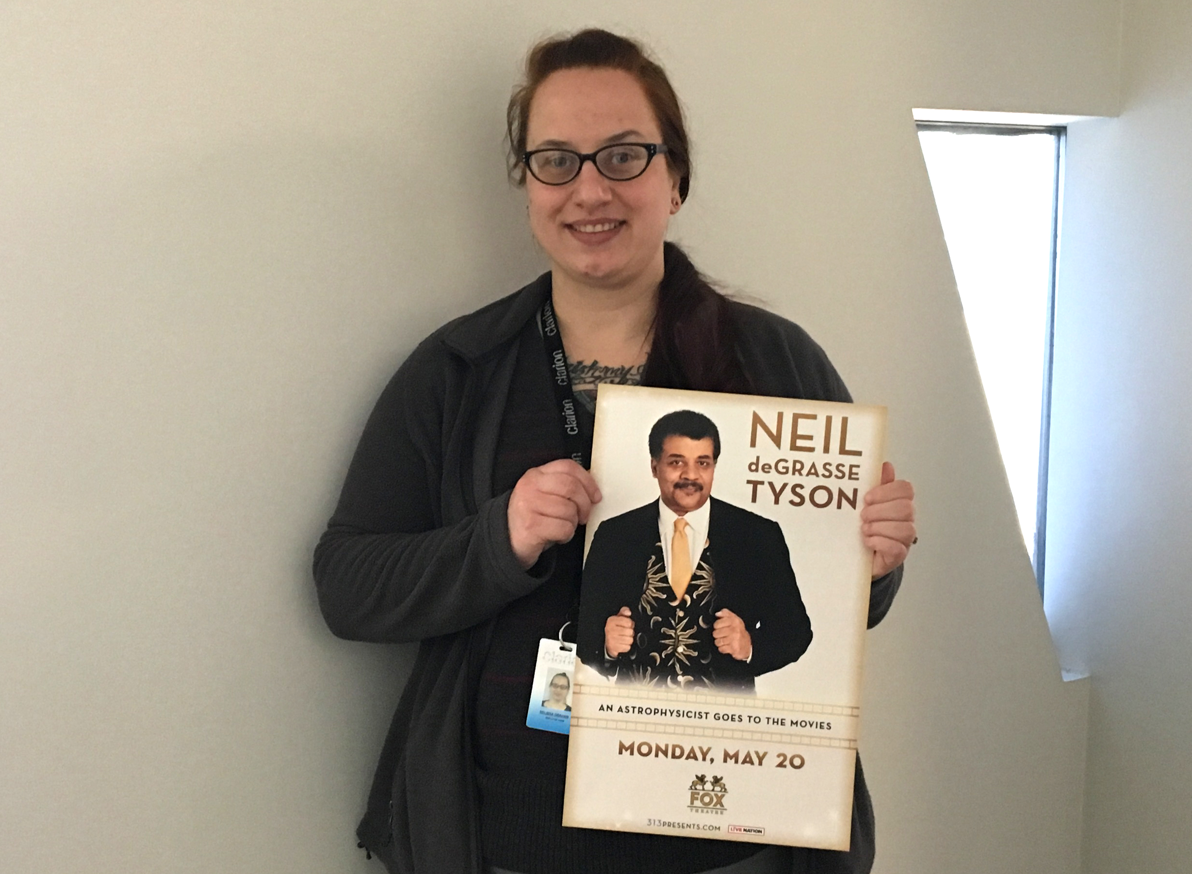 Melissa holding Neil deGrasse Tyson poster