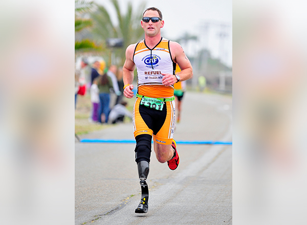 Eric McElvenny, who lost his right leg while serving in Afghanistan, has run eight Ironman Triathlons.