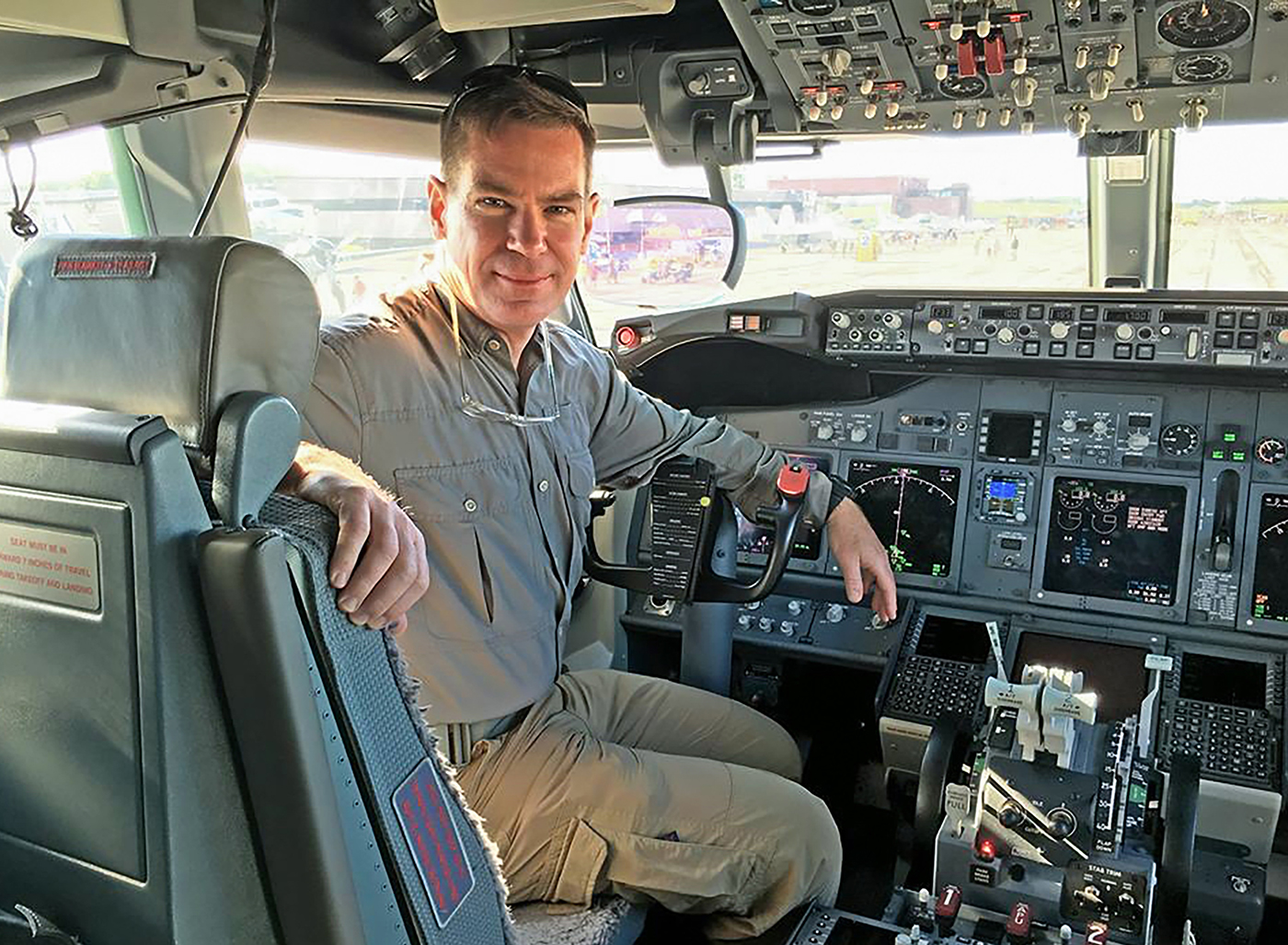 HFC student/ex-Airborne Ranger Tom Demerly sits in the cockpit of a newly-built Boeing P-8A Poseidon anti-submarine warfare aircraft. Photo by Lance Riegle, TheAviationist.com. 