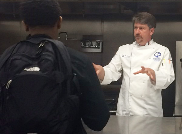 Student listening to Chef Eric Gackenbach lecture