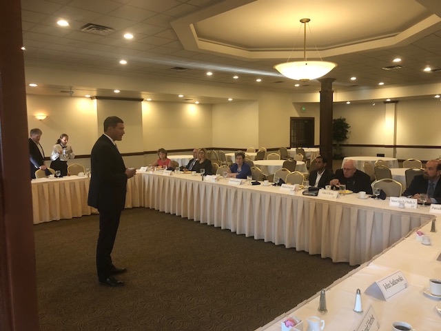 Group of people at skirted tables