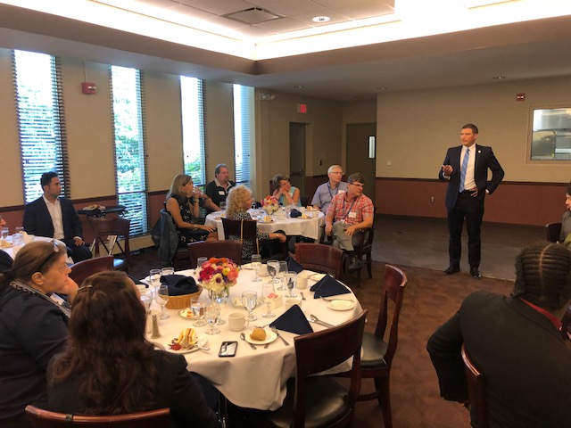 Groups of people at round tables