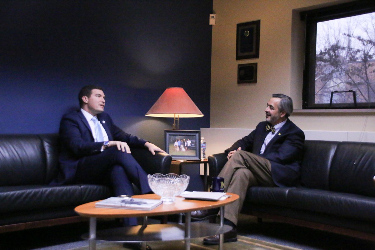 Russell Kavalhuna sitting across from Domenico Grasso