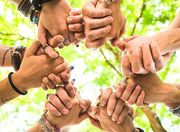 circle of hands clasped
