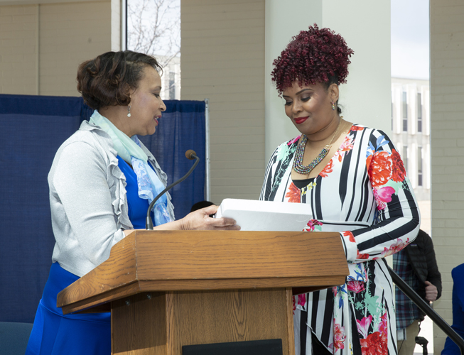 Staff award winner Katrina Minnis receives her award from Rhonda Johnson