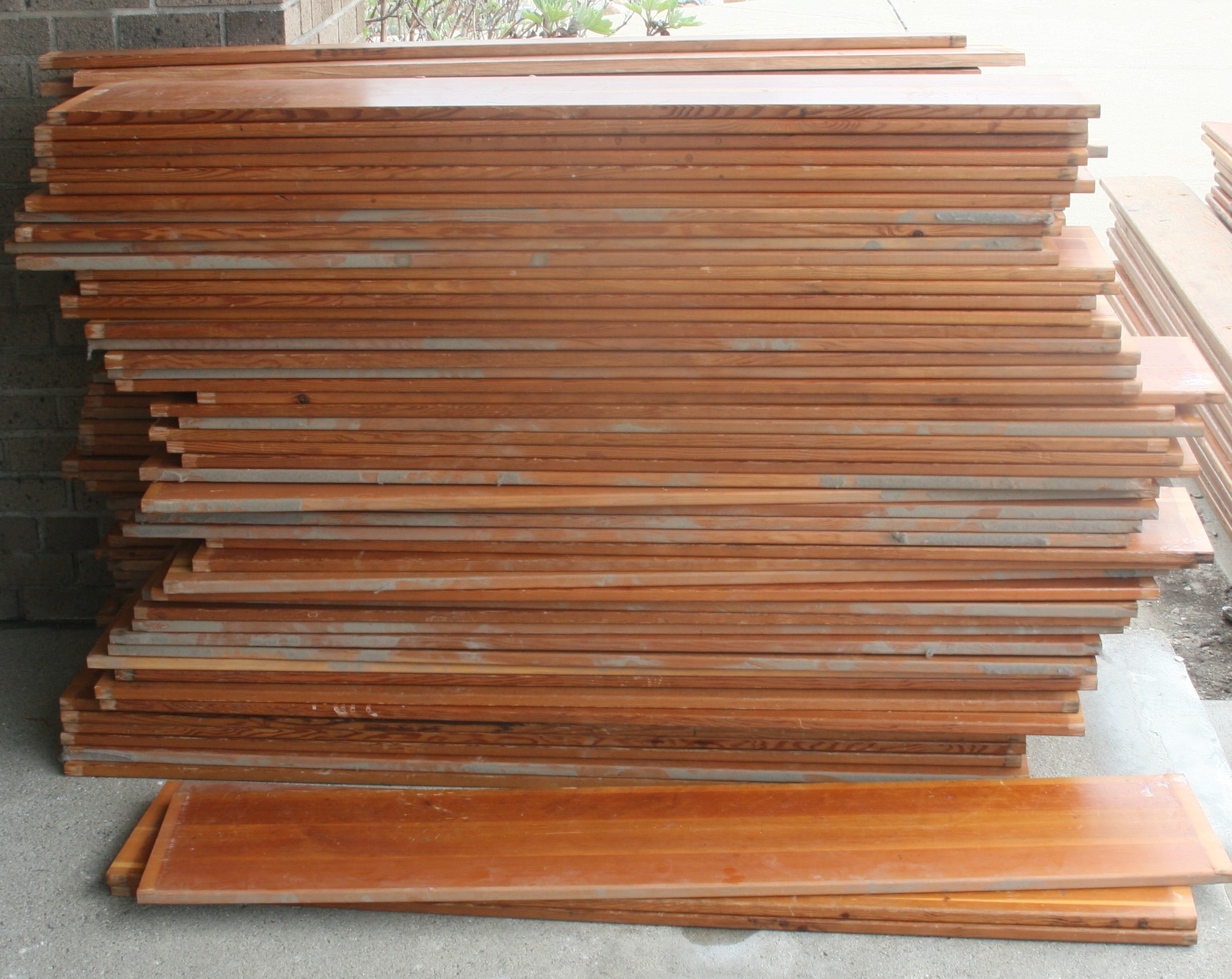 The bleachers' wood sat in neat stacks before final removal from the gym. 