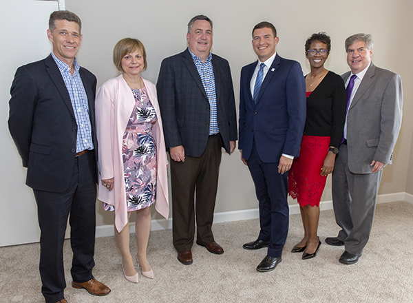 Key project partners, L-R: HFC architectural construction coordinator and instructor Chad Richert, HFC interior design program coordinator and instructor Karen Wilmering, Henry Ford Village Executive Director Bruce Blalock, HFC President Kavalhuna, HFC B