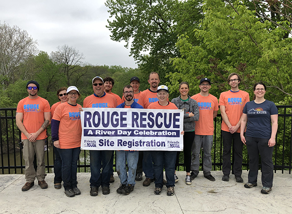 Group of people holding a sign