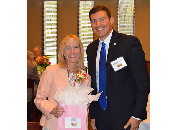 HFC President Russell Kavalhuna gives retiree Jan Artushin her gift. 