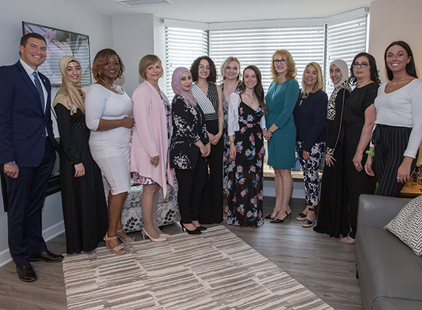 President Kavalhuna with HFC instructor Karen Wilmering and HFC interior design students