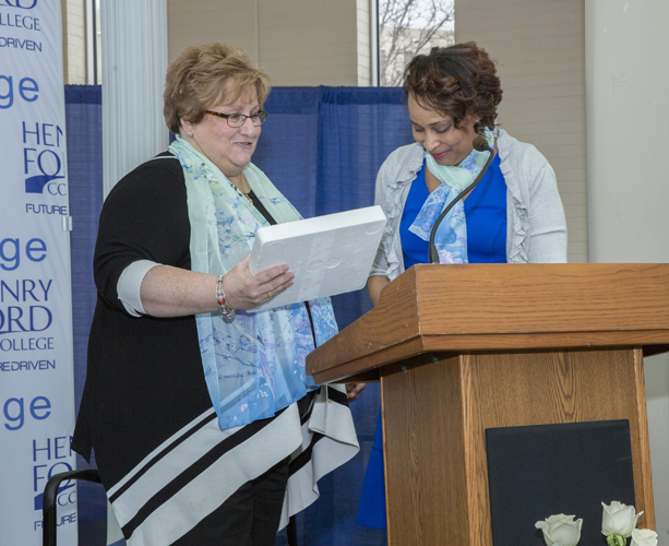 Administrator award winner Debbie Szymanski receives her award from Rhonda Johnson
