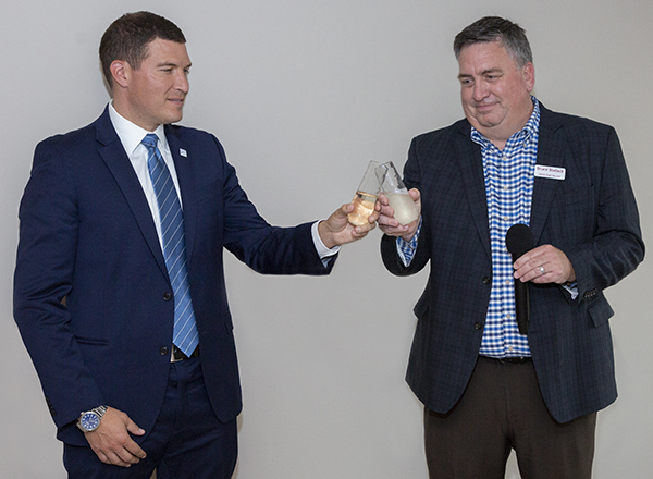President Kavalhuna and HFV Executive Director Bruce Blalock toast the partnership and accomplishments.