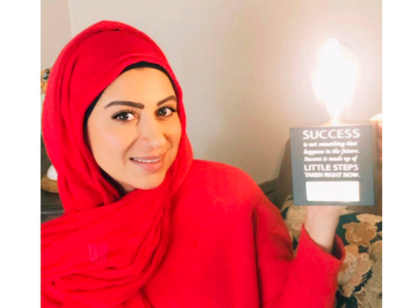 Shami presents her award, inscribed, "Success is not something that happens in the future. Success is made up of little steps that happen right now."