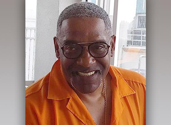 A headshot of Andre Archer.