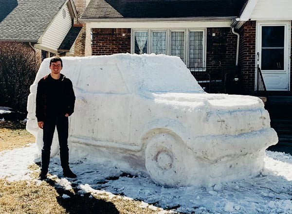DiMaria stands next to his life-size Bronco sculpture. The interior cannot accommodate riders this year. 