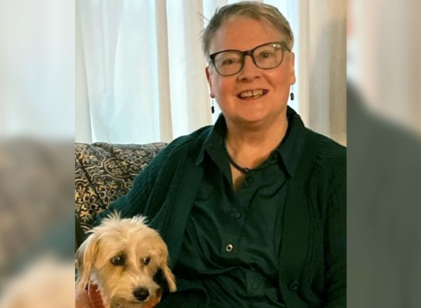 An image of Anne Dinnan and her dog.