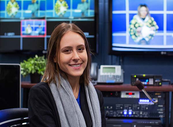 Media student at editing console.