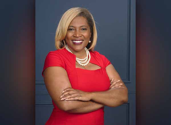 Portrait of Pamela Pugh in a red dress