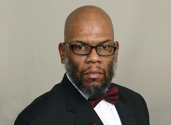 A headshot of Dr. Kalvin DaRonne Harvell.