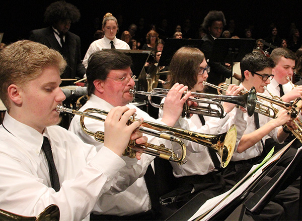 Several students playing musical instruments. 