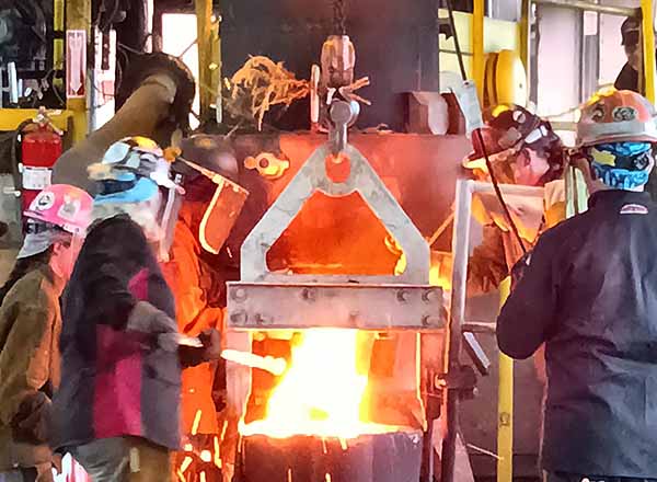 Members of the Ironic Femmes melt the metal at the Student Cupola Contest. 