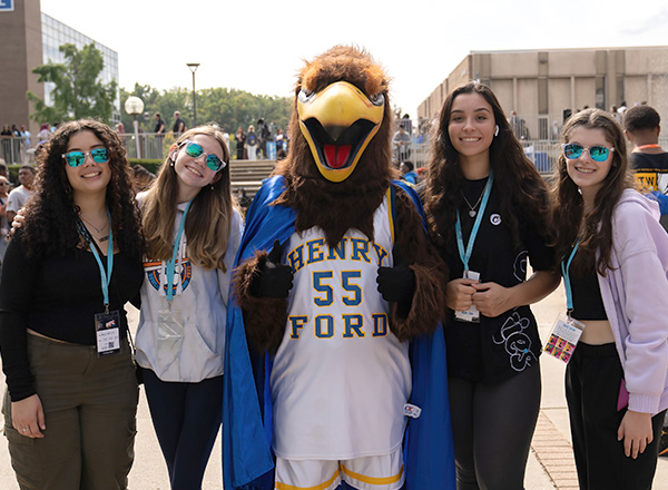 The Hawkster flanked by enthusiastic students.