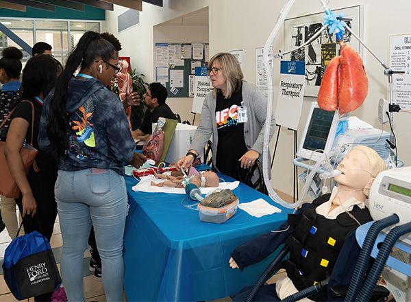 Students visit the respiratory therapy table.