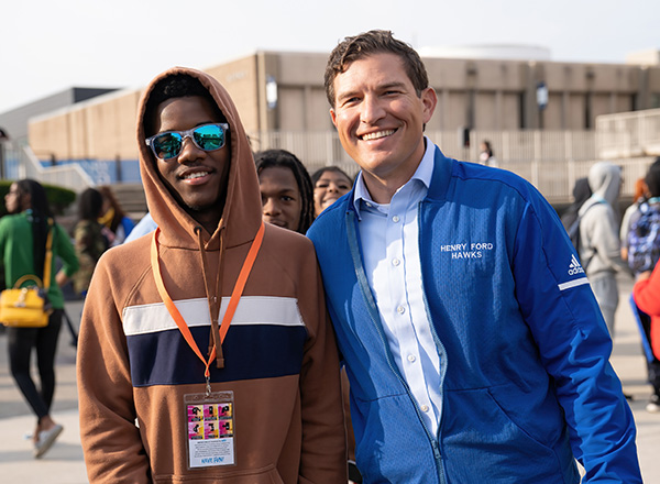 President Russ Kavalhuna posses with a high school student.