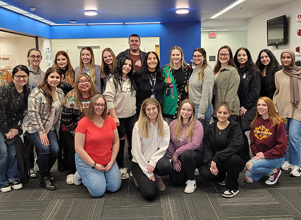 Sophia Beydoun, center, surrounded by students.