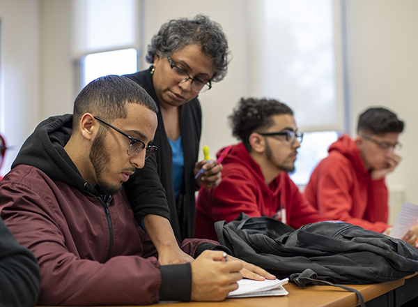 HFC math instructor helping students