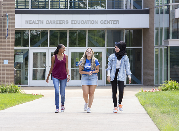 Three students walking outside