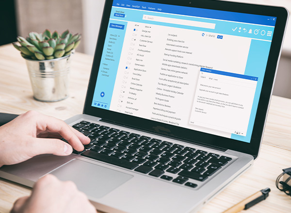 A laptop with office desk background.